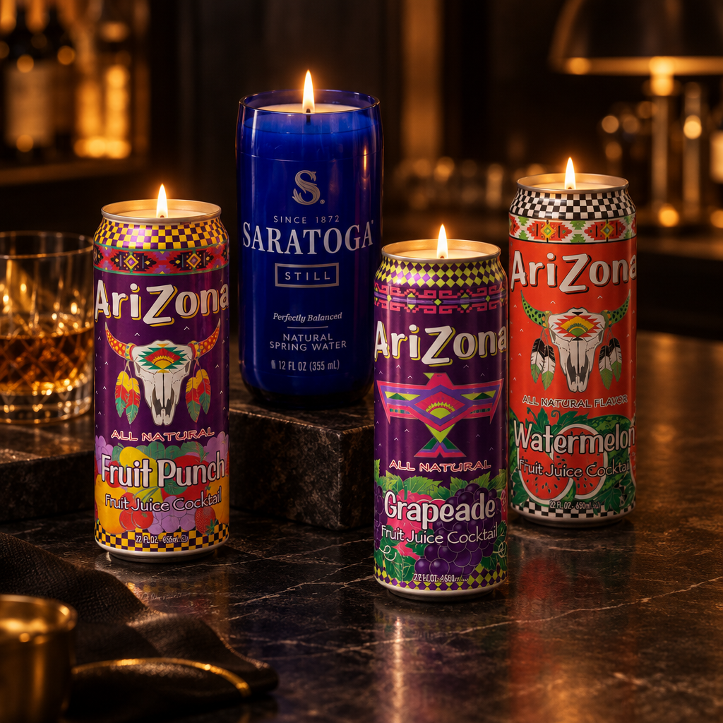 Colorful beverage-can candles and a tall blue bottle candle glowing on a dark bar